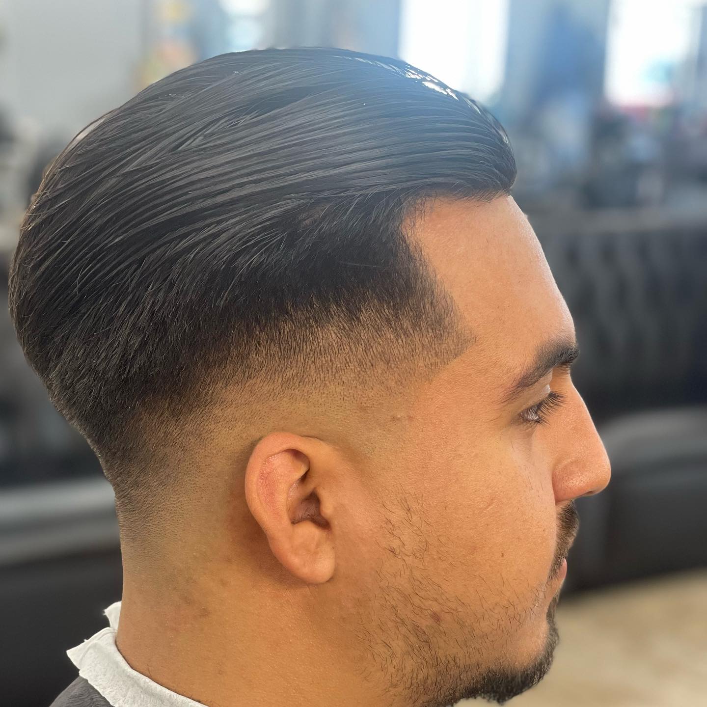 The barbers of A Cut Above The Rest at the shop, 2023