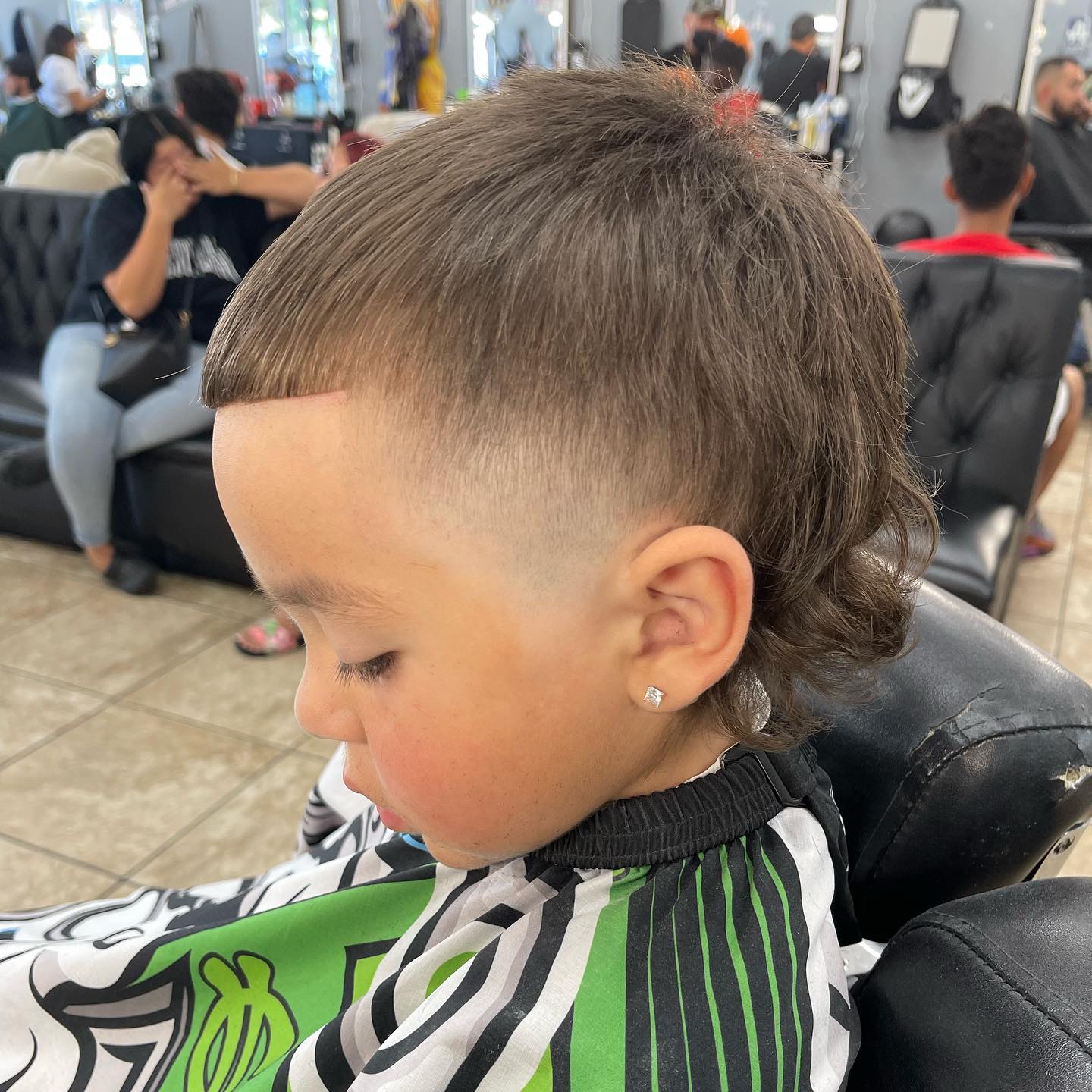 A barber at the shop, 2023